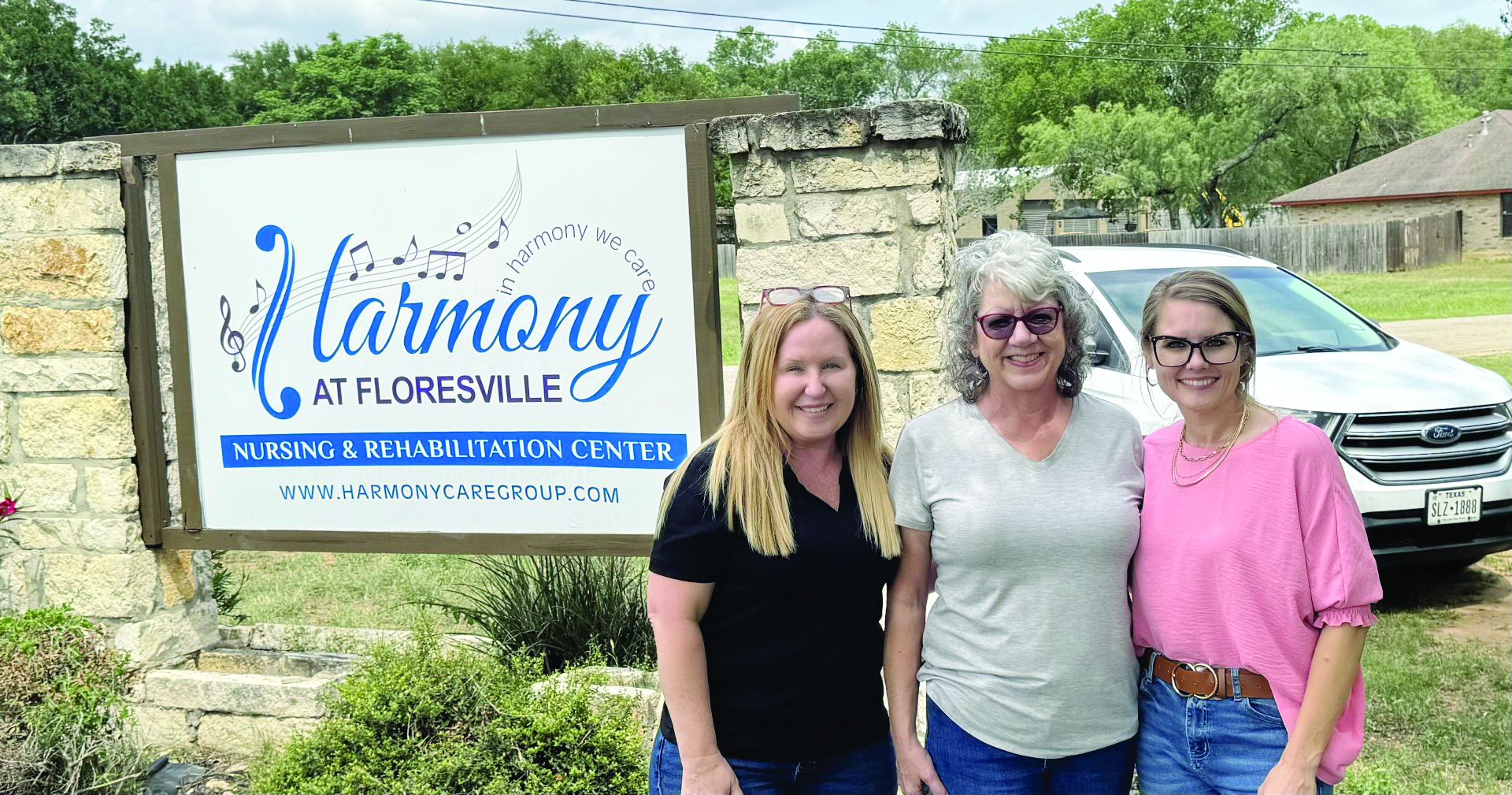 Barbara, Geneva, and Cheryl of Coastal Plains Trucking stand in front of Harmoney Floresville Nursing and Rehabilitation Center.